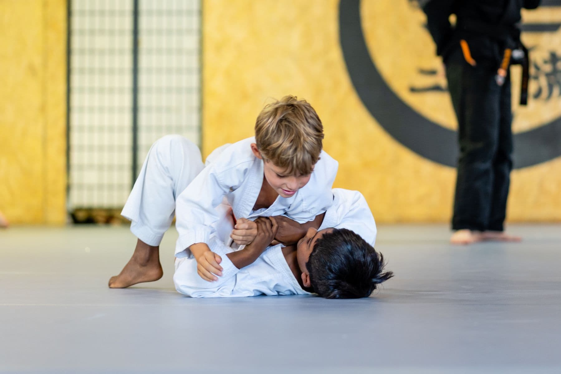 Two students grappling